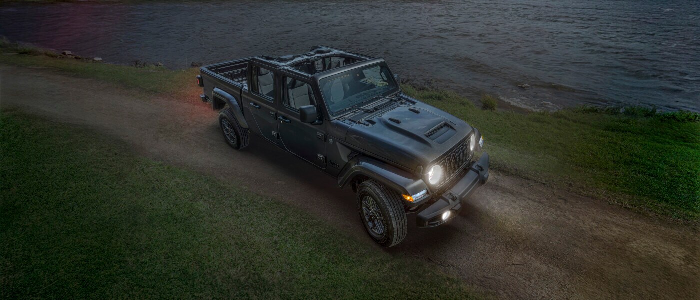 2026 Jeep Gladiator Exterior From Above Near Lake With Headlights