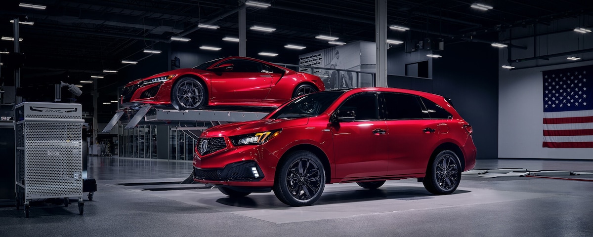 Acura MDX PMC Edition next to an Acura NSX