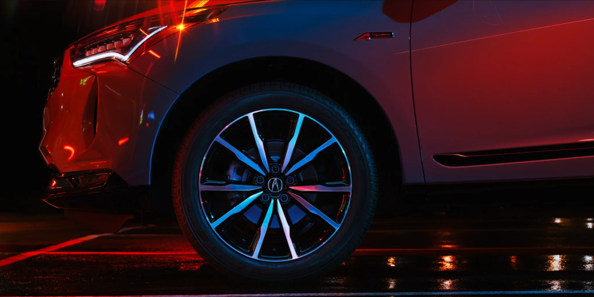 2026 Acura RDX A-Spec Wheel and Fender 2026 Acura RDX A-Spec wheel and front fender under red accent lighting