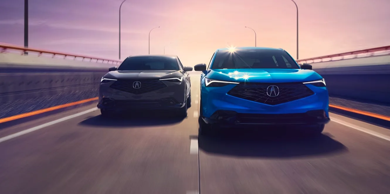 Blue Acura ADX side profile shown at sunset