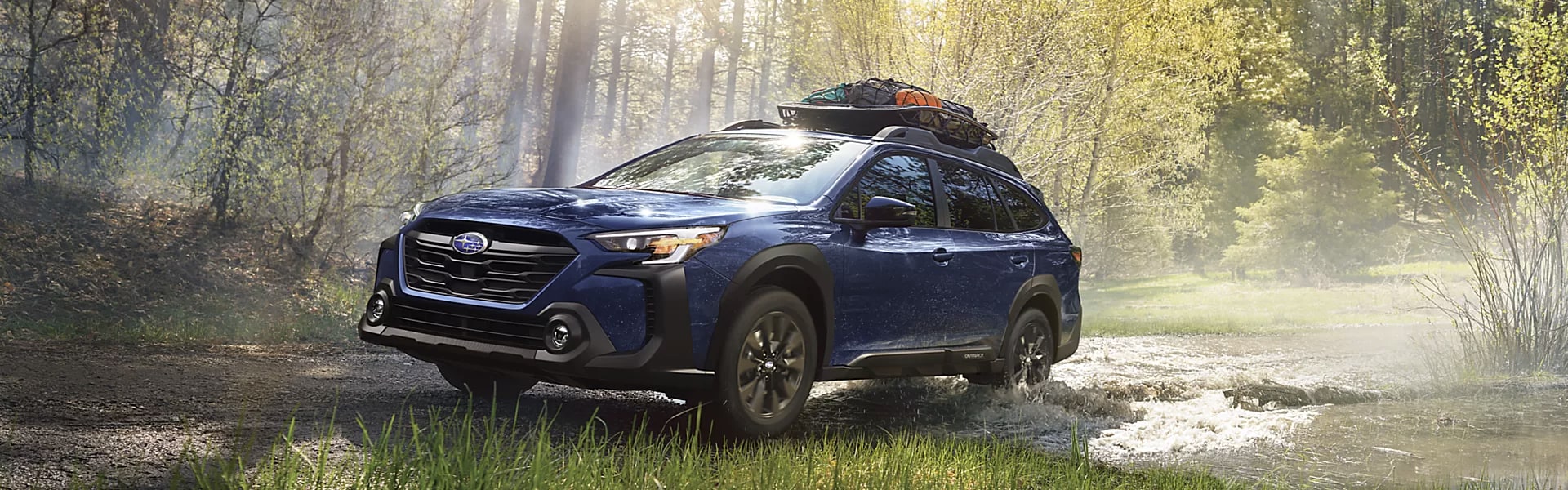 2024 Subaru Outback Onyx Edition XT banner.png 2024 Subaru Outback Onyx Edition XT running in the wood outdoor activities