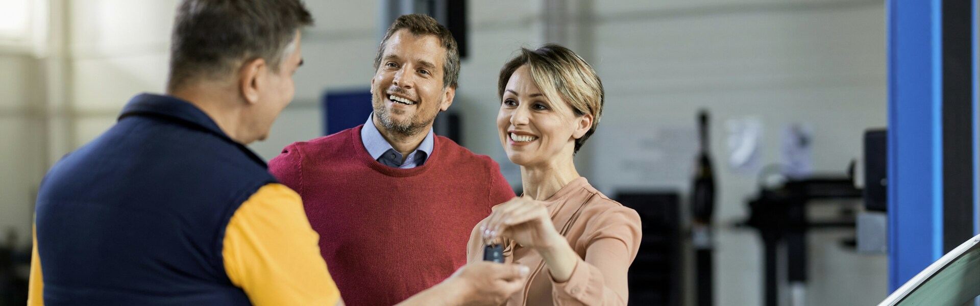 couple receiving vehicle key from agent.png couple receiving vehicle key from agent