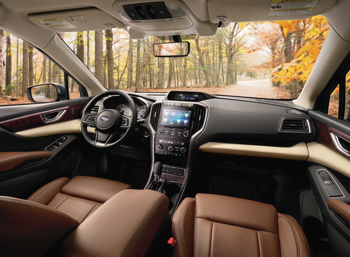 new 2019 Subaru Ascent interior with brown leather upholstery, wood panels and touch screen media hub