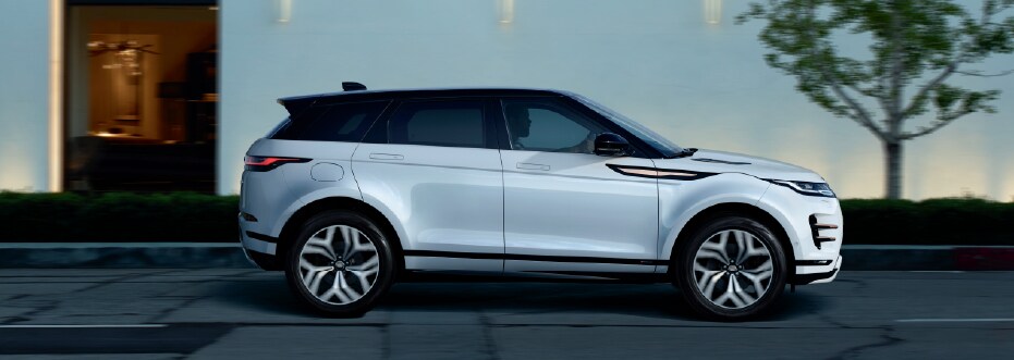 Silver Range Rover Evoque parked in city
