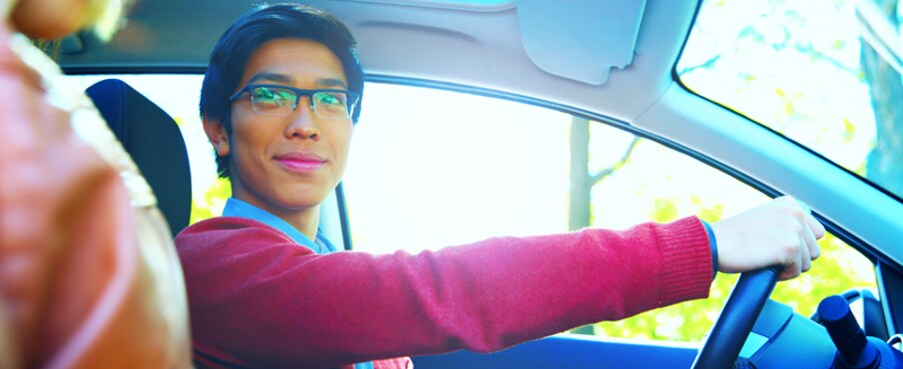Man Test Driving a Car