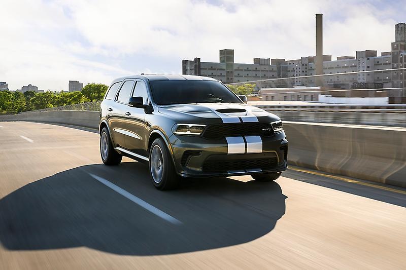 2027-Dodge-Durango-11.png 2027 Dodge Durango with 2white strips driving in city