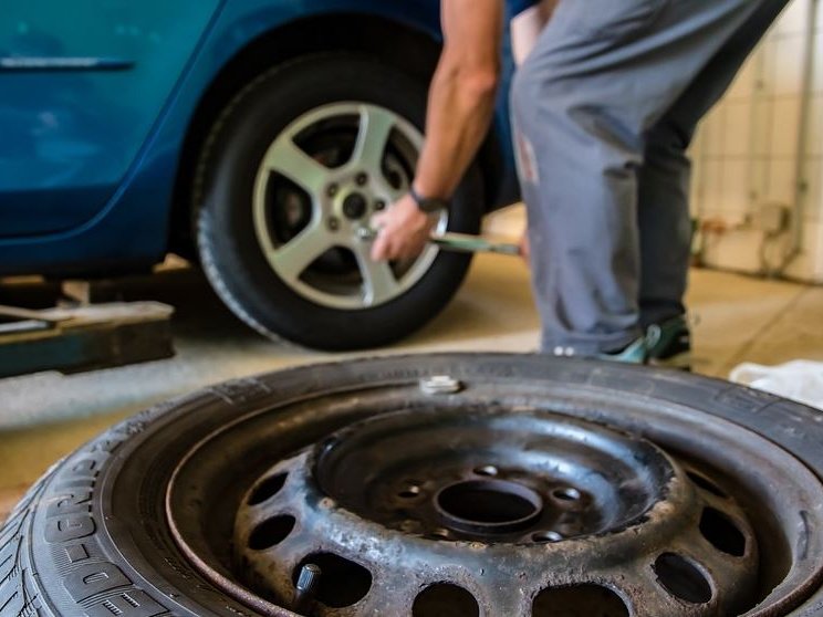 image of owner rotating his own Nissan Tires