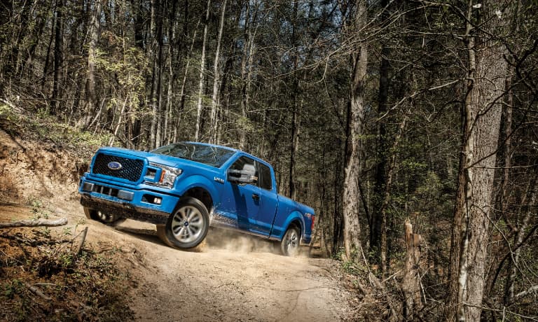 2020 Ford F-150 driving through the woods