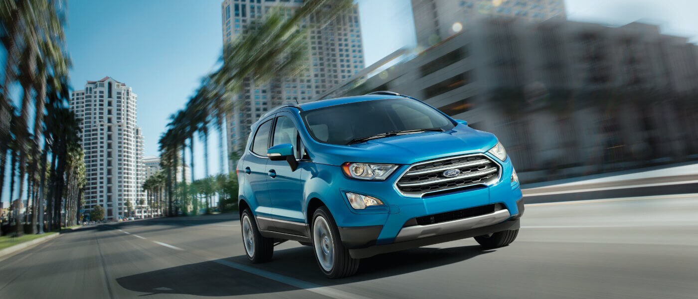 Blue 2019 Ford EcoSport driving through the city