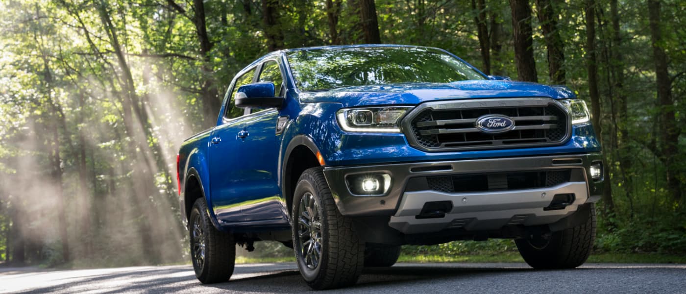 2020 Ford Ranger driving under trees on a road