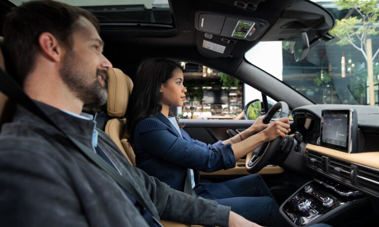 2020 Lincoln Caorsair interior with couple driving
