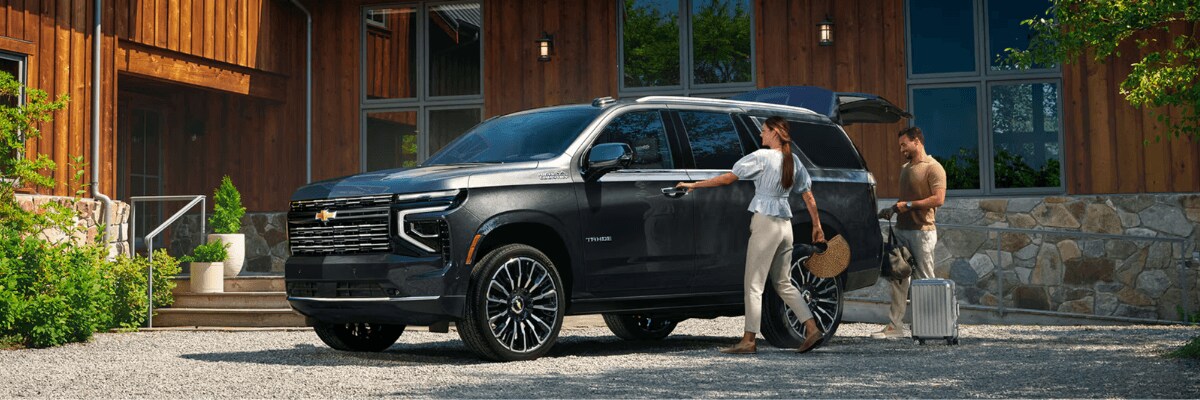 final%20CTA.png A couple loading up stuff onto Chevrolet Tahoe SUV