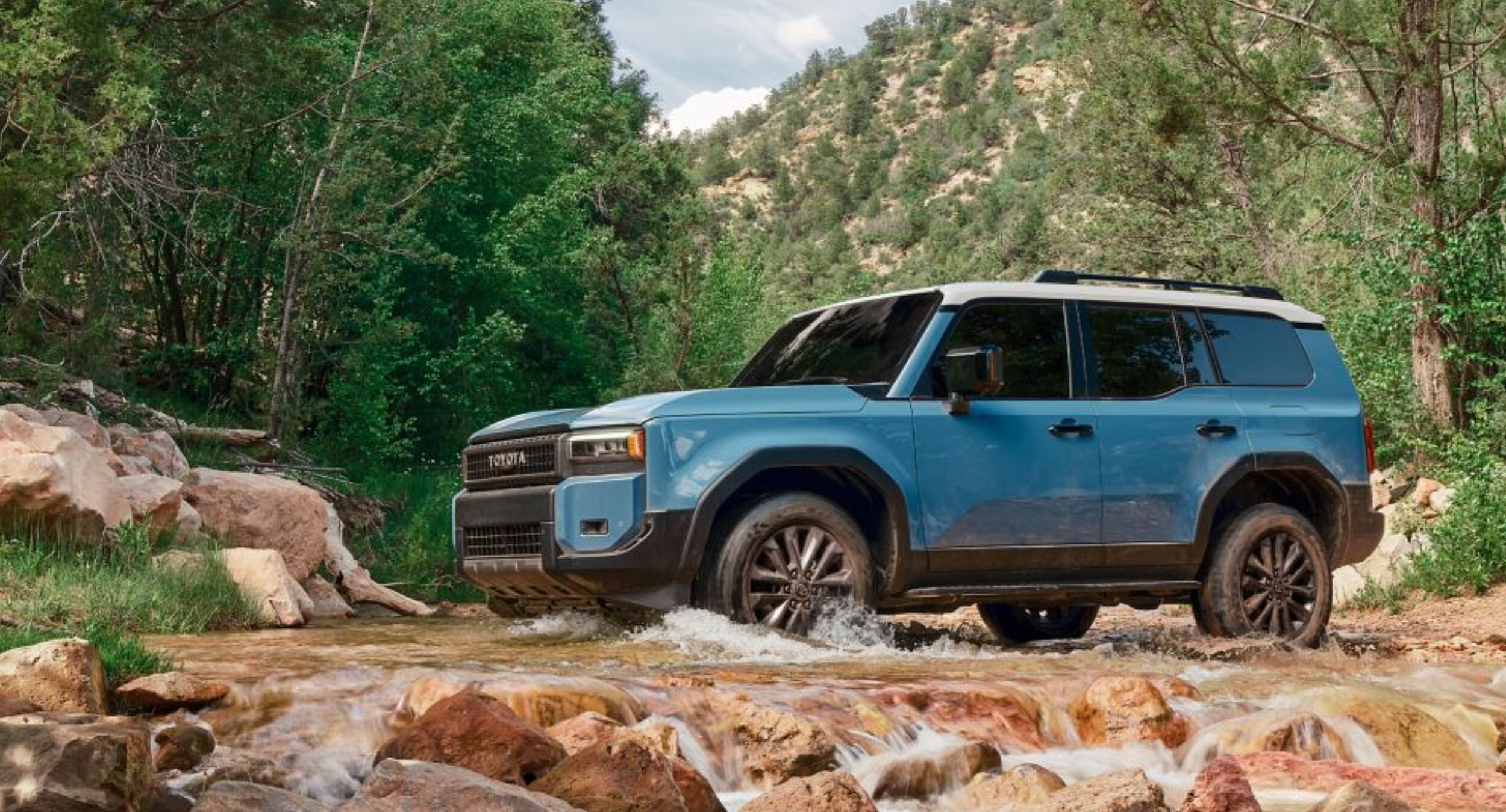 2024 Toyota Land Cruiser in Heritage Blue with Grayscape roof near Huntsville.png