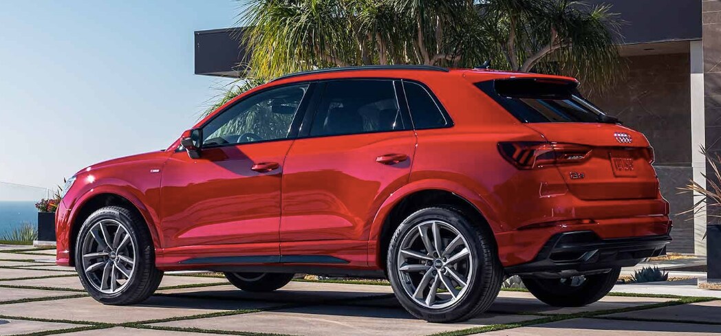 2023 audi q3 red 2023 audi q3 parked at a boujie apartment overlooking the sea