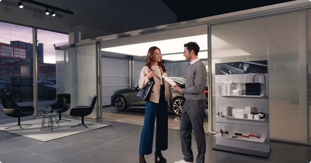 Audi service center technician performing vehicle maintenance