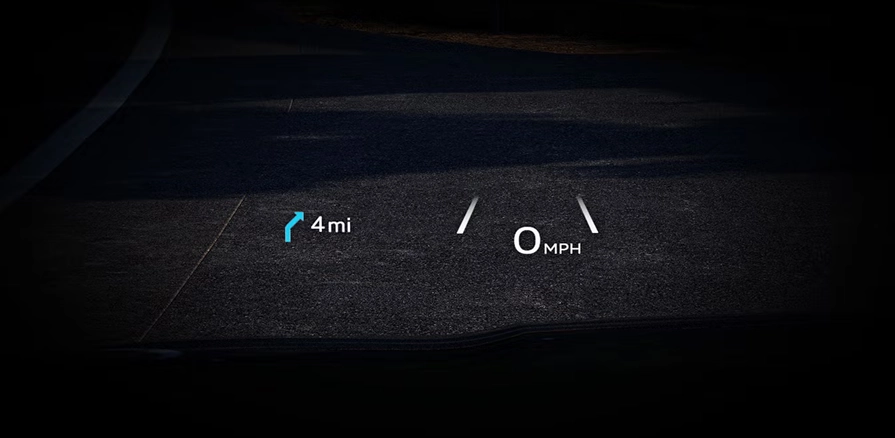 Head-up display projecting speed and navigation distance onto the road ahead at night