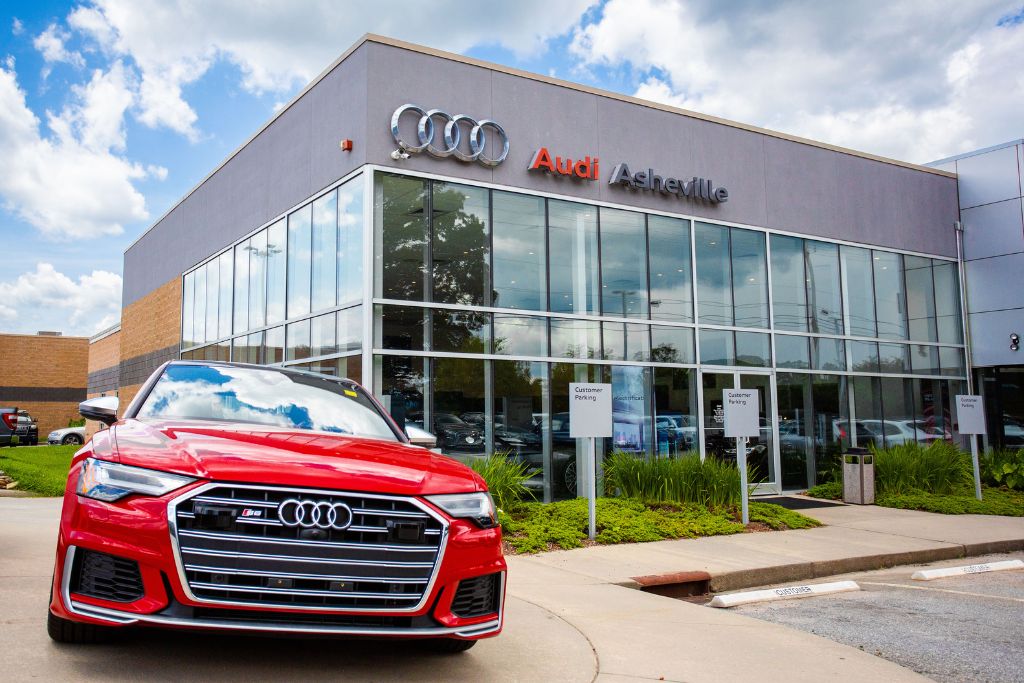 audi-certified-pre-owned-nc.jpg Audi certified pre owned car, shown in bright red, parked in front an Audi dealership in Asheville, NC
