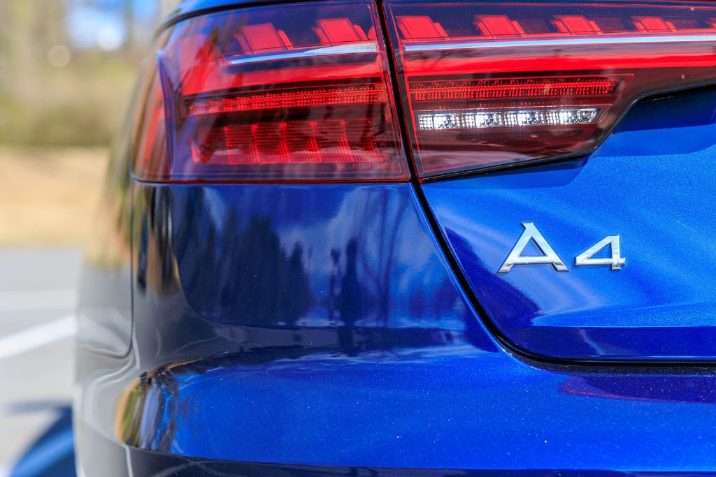 2024-audi-a4-quattro.jpg Closeup rear view of blue 2024 Audi A4 for sale