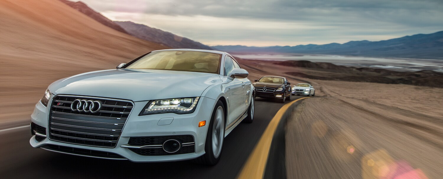 Audi-S7-BMW-650i-Gran-Coupe-Mercedes-Benz-CLS550-front-three-quarter-in-motion2.jpg Audi Vs BMW
