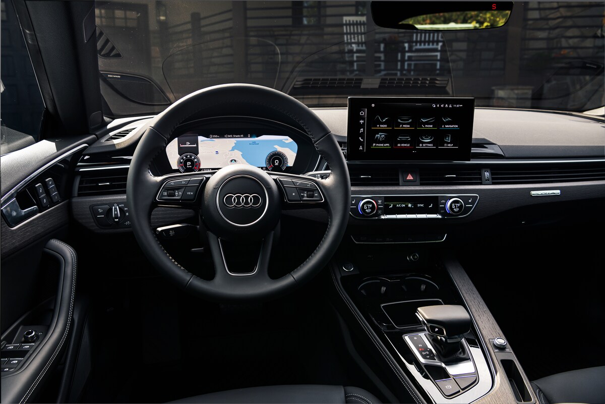 2022-Audi-A5-PremiumPlus-40TFSI-Sportback-I01.png black Audi A5 sportback interior dashboard and steering wheel