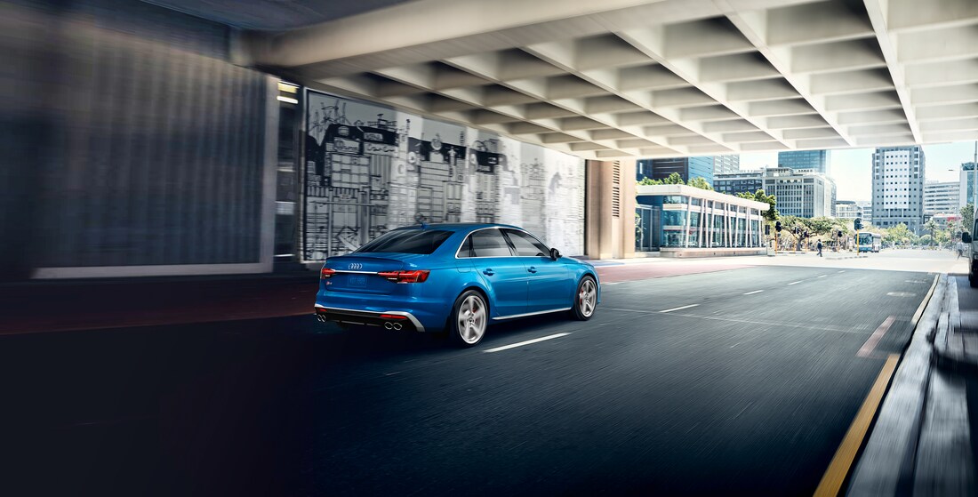 2023-Audi-S4-Prestige-SSportPackage-Sedan-L03.png blue Audi S4 sedan driving through an underpass