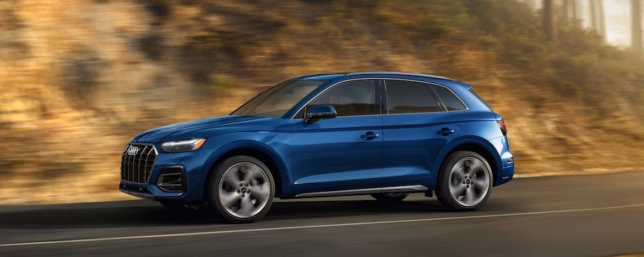 2021 Audi Q5 A blue 2021 Audi Q5 driving along a highway