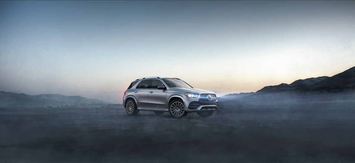 2020-MercedesBenz-GLE-3504MATIC-AMGLine-WheelAddOn-SUV-L01.png silver Mercedes-Benz GLE 350 SUV parked on a misty mountain road