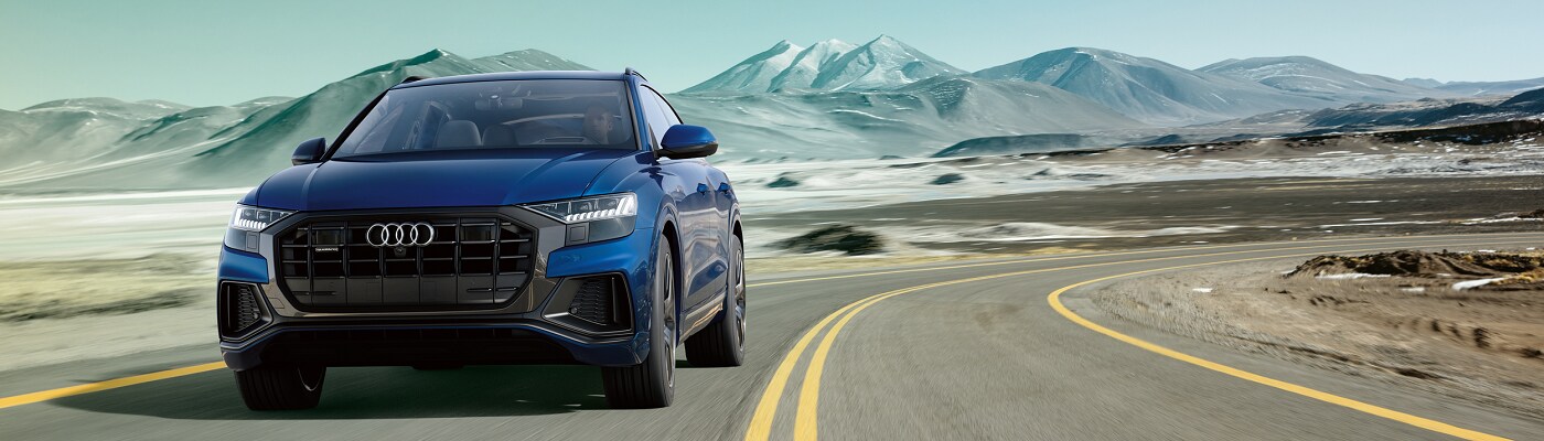 Audi Q8 Prestige Audi Q8 Prestige driving on a mountain road