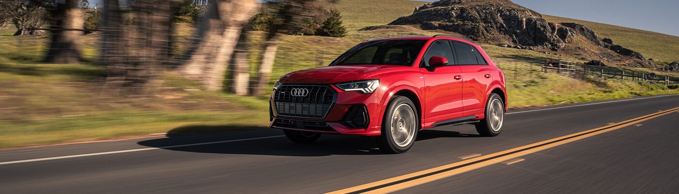 Audi Q3 Red Audi Q3 S Line driving through the countryside