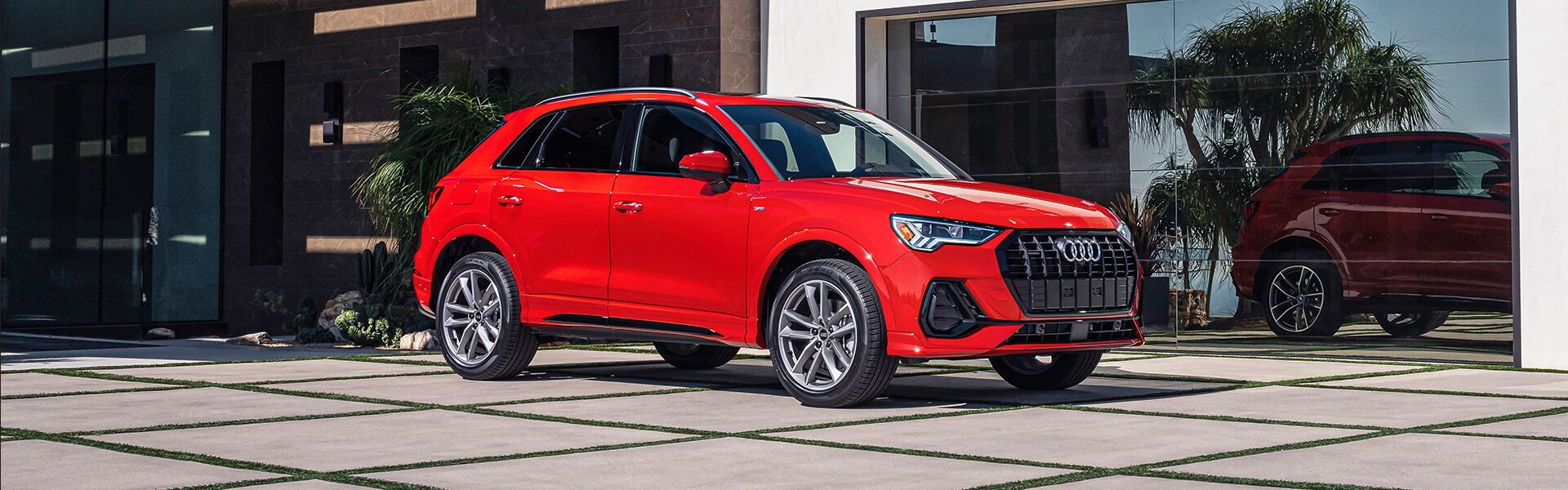 2024 Audi Q3 in red parking outdoor.png 2024 Audi Q3 in red parking outdoor