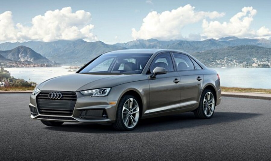 Grey 2020 Audi A4 parked next to mountains | available soon at Audi of Nashua