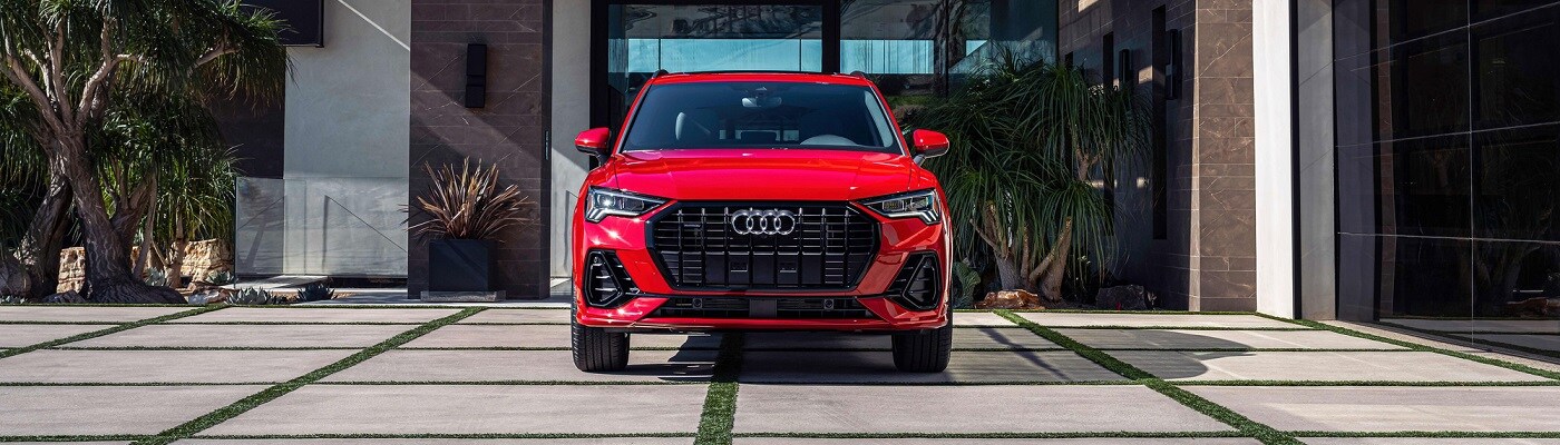 Audi Q3 Red Audi Q3 S Line parked in front of a modern house