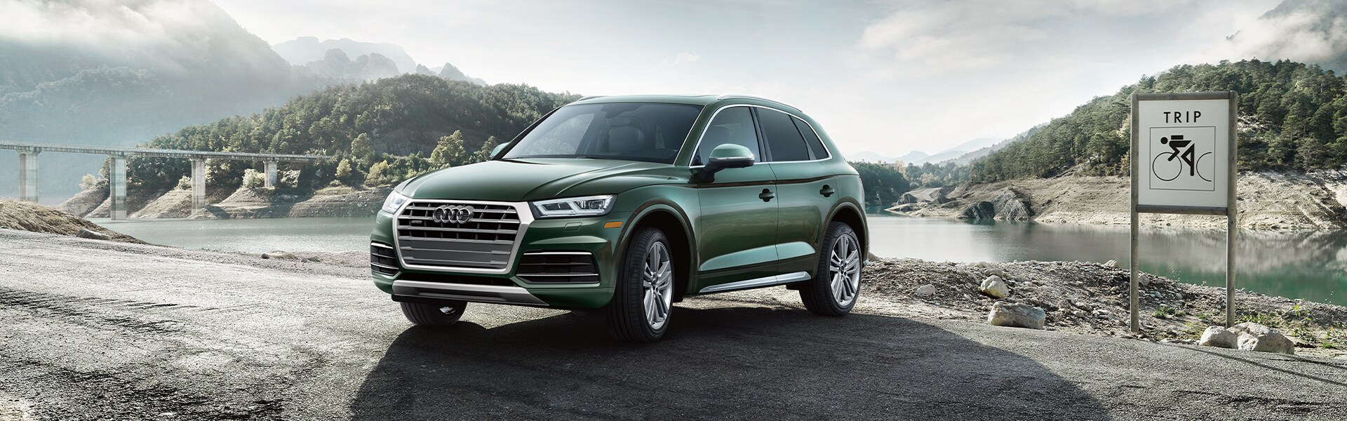 Comparison of the 2020 Audi Q5 & the 2020 Mercedes-Benz GLC at Audi Owings Mills | Green 2020 Audi Q5 Parked on Gravel Road Comparison of the 2020 Audi Q5 & the 2020 Mercedes-Benz GLC at Audi Owings Mills | Green 2020 Audi Q5 Parked on Gravel Road
