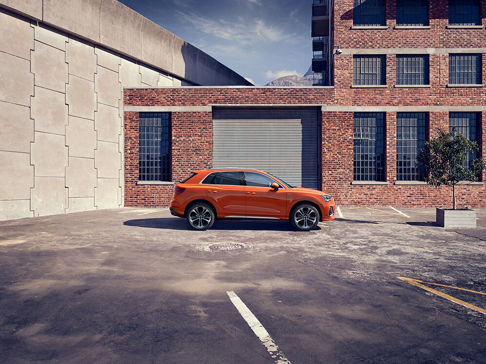 Audi Owings Mills is a Car Dealership in Pikesville near Owings Mills MD | 2020 Audi Q3 parked outside of garage