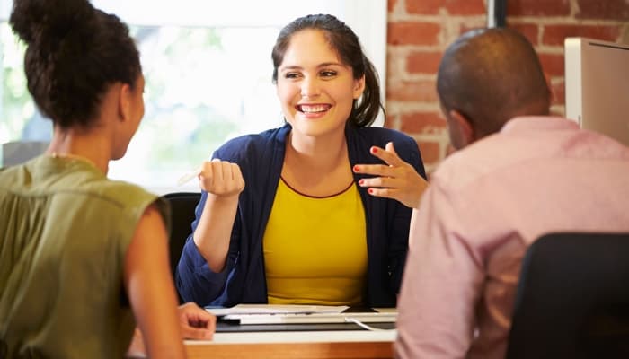Couple Meeting With Finance Woman