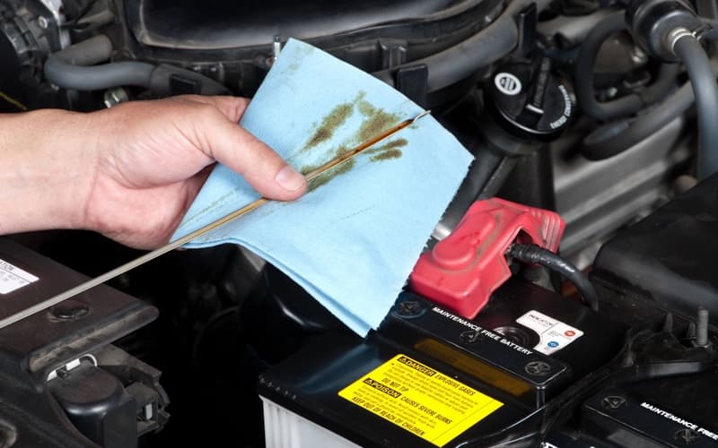 Auto Mechanic Checking Oil_7452791.jpg