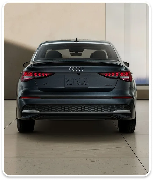 Rear view of a black Audi A3 showing its taillights and boot lid