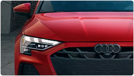 Close-up of the Audi A3 LED headlight, grille and Audi rings