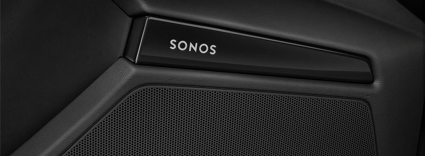 Close-up of a Sonos speaker grille set into the Audi A3 door trim
