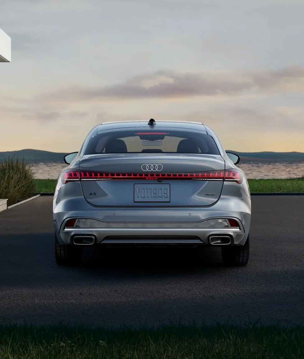 Rear view of a grey Audi A5 with its LED light strip