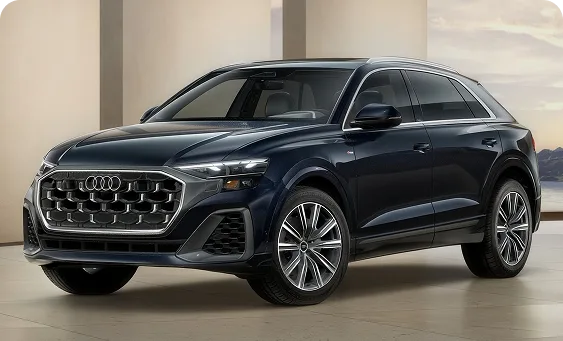 Dark blue 2027 Audi Q8 Premium parked in a studio setting
