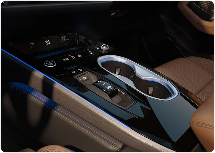 Audi A6 Sedan center console with blue ambient lighting beside brown leather seats