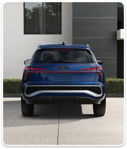 Rear view of a blue Audi Q3 showing its taillights and tailgate