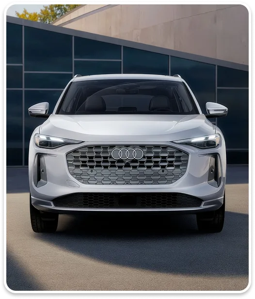 Front view of a white Audi Q5 showing its Singleframe grille and headlights