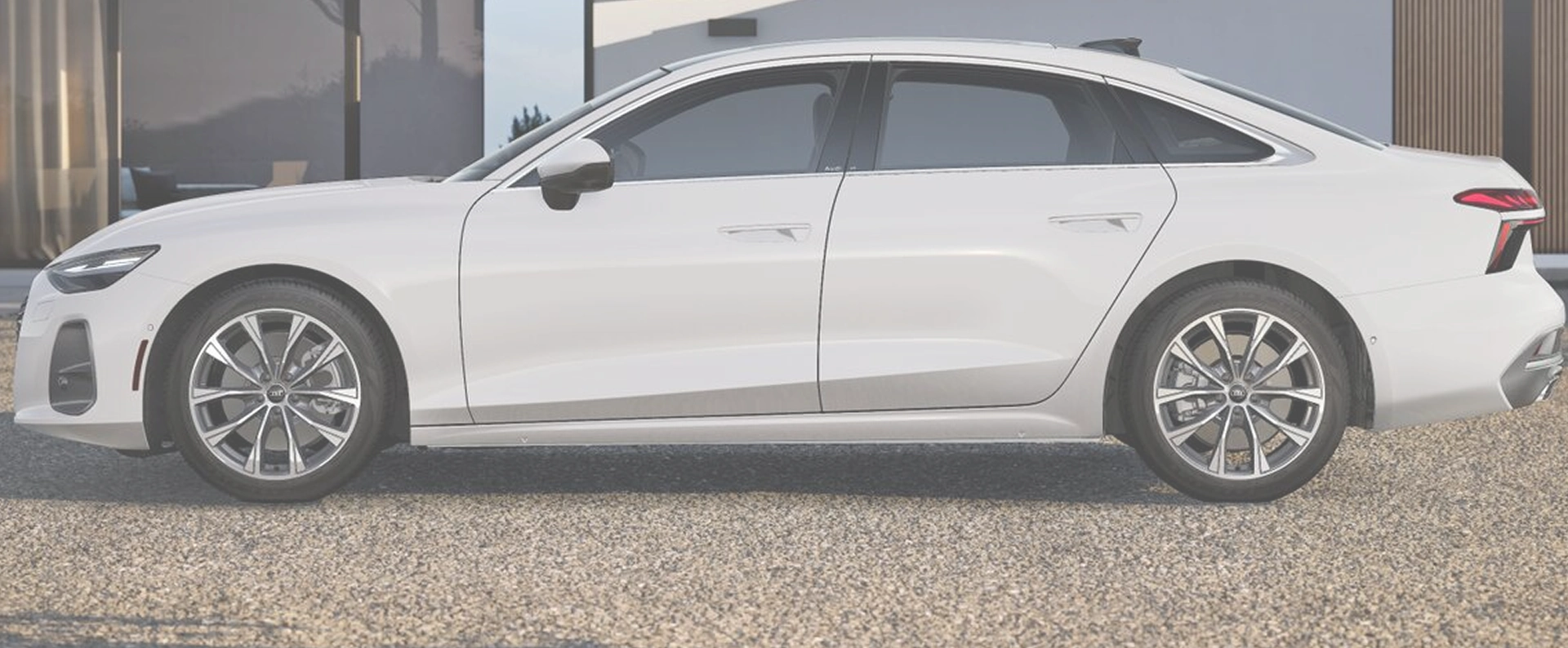 White Audi A6 Sedan in profile, used as a washed-out backdrop