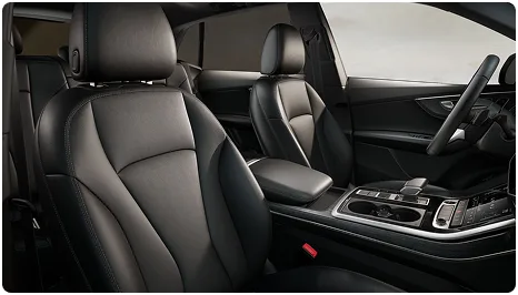 Audi Q8 front seats and centre console seen from above through the panoramic roof