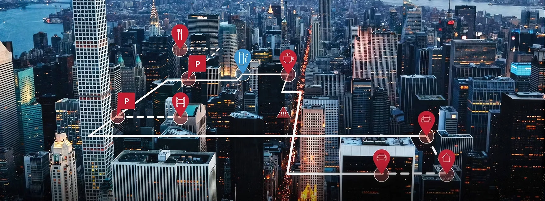 Night-time aerial view of a city overlaid with connected-vehicle data markers