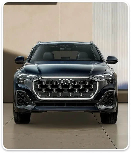 Front view of a blue Audi Q8 showing its Singleframe grille and headlights