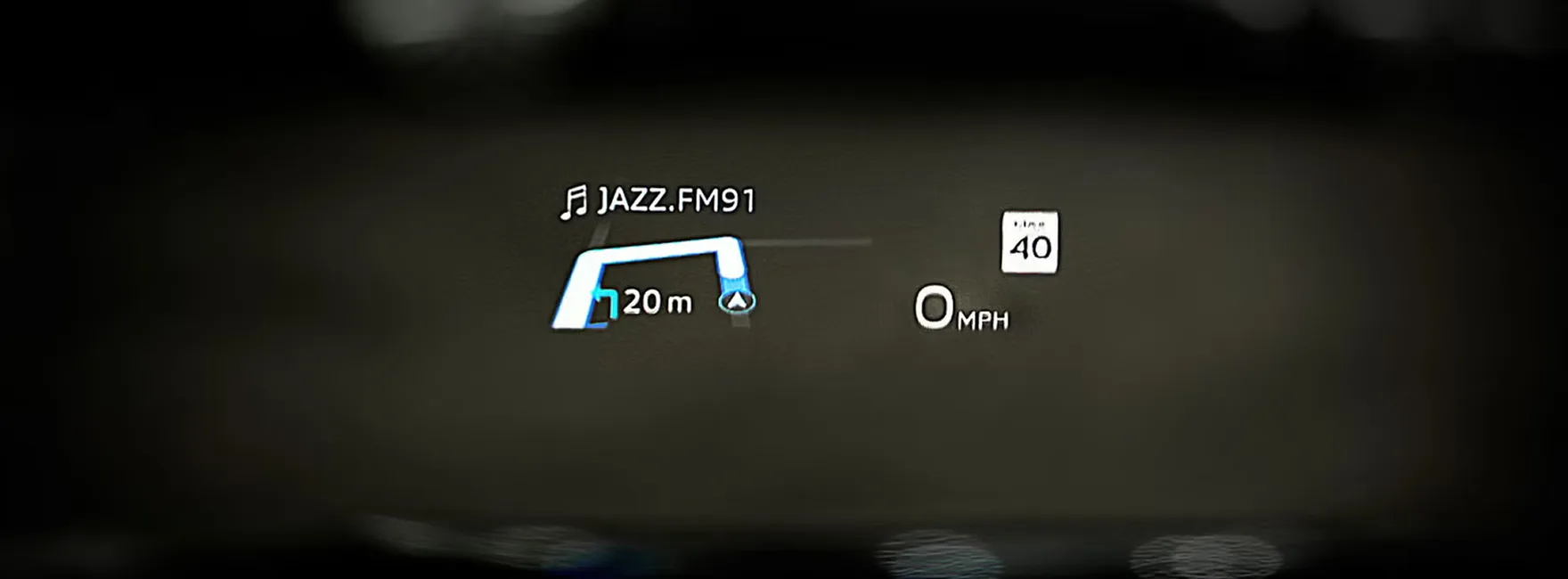 Head-up display projecting navigation and speed onto the Audi Q3 windshield at night