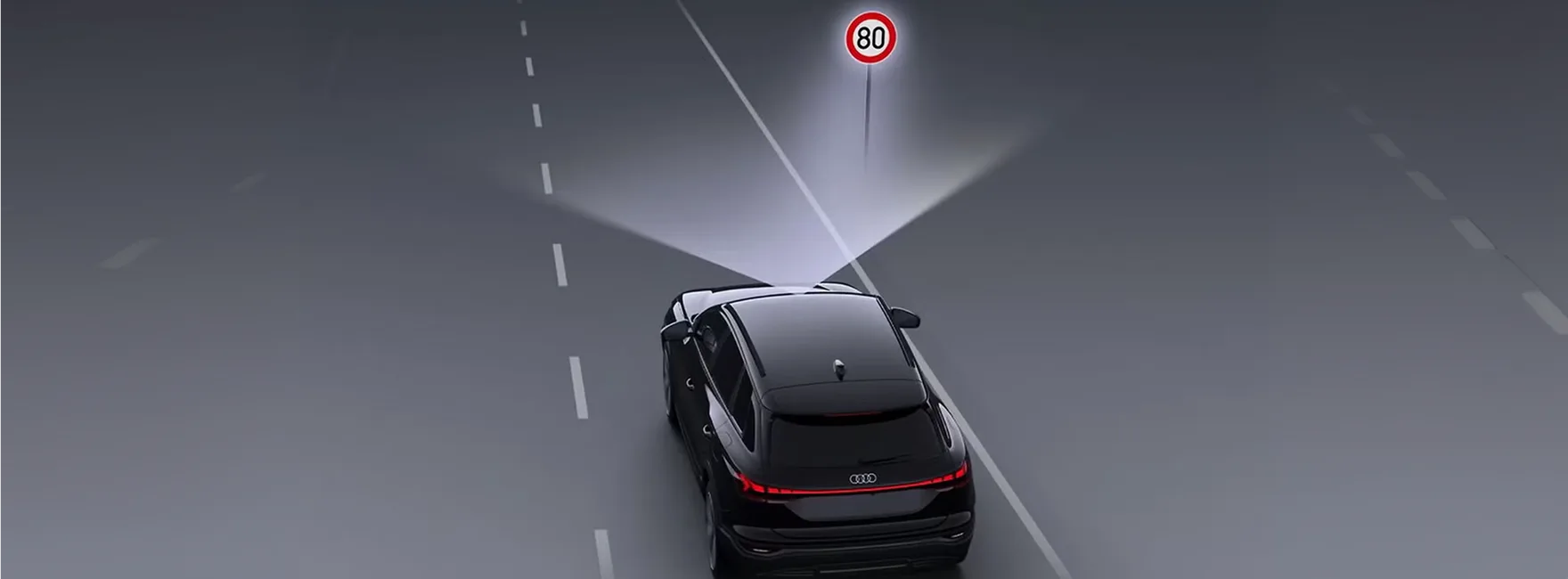 Illustration of traffic sign recognition detecting a speed limit sign ahead of an Audi Q3